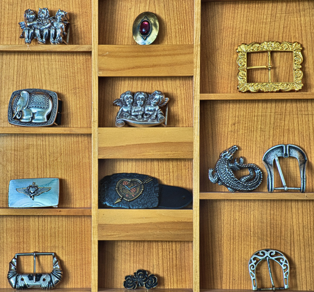 Buckles stored on a shelf for originally looking belts made by Hepco