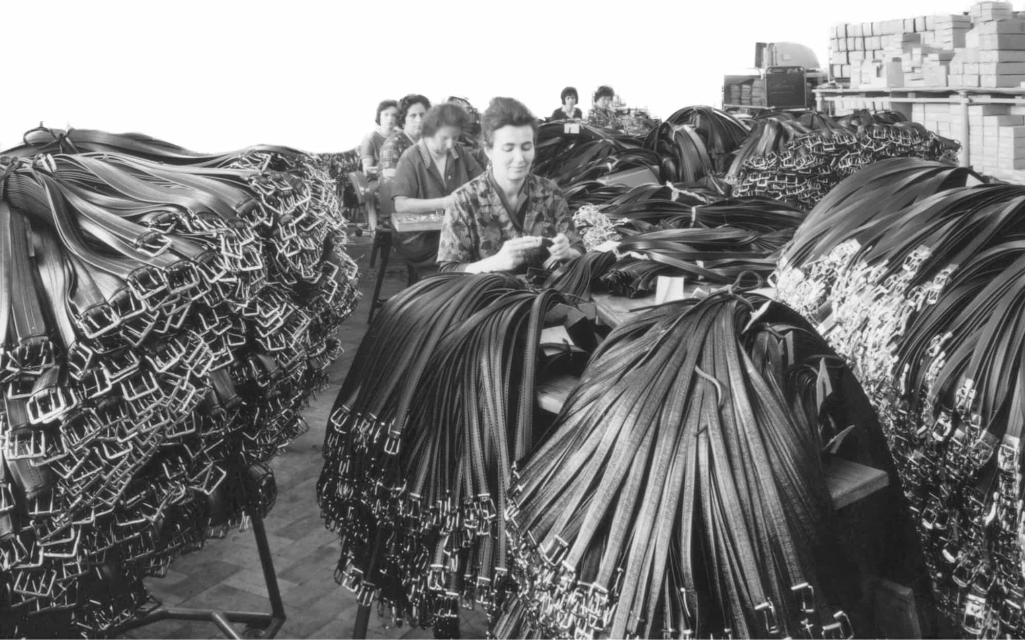 Workers of Hepco Company finish a big amount of leather belts.